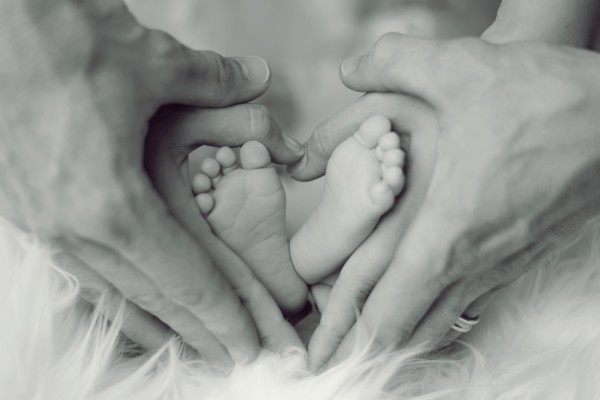 Baby Feet with Parents Hands - Adoption