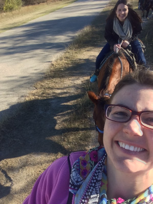 Elizabeth and her sister horseback riding.