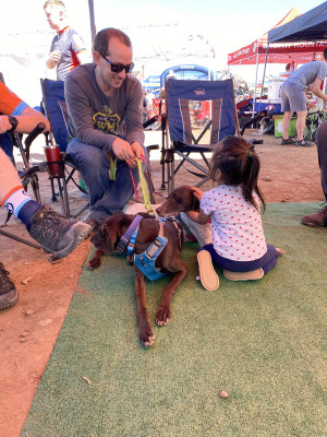 Lee's hanging out with our friends daughter and our dogs.