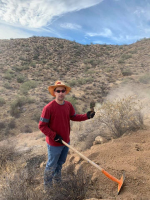 Lee volunteering for mountain bike trail maintenance.