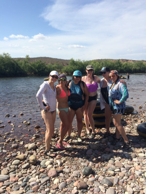 Hanging out with friends tubing the river.