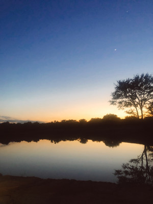 We have a ranch about 30 miles from our house with a stocked lake and river frontage. 