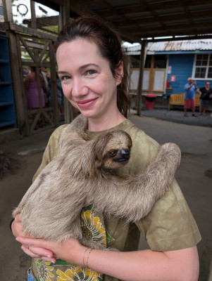 Kaye holding a sloth in Honduras.