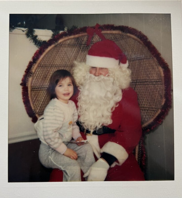 Kaye as a child, meeting Santa.