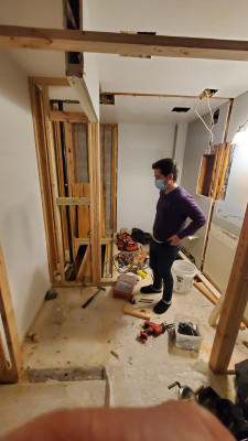 Jim inspecting David's work on the bathroom renovation