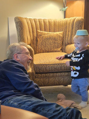 Henry with a bowl on his head, being silly with Grandpa 